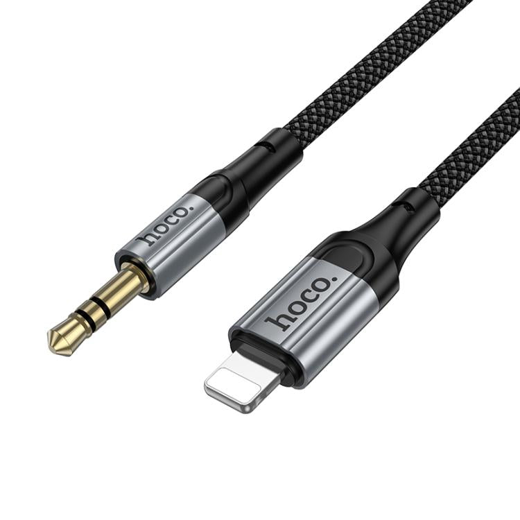 HOCO UPA33A audio cable connecting iPhone to car stereo system.

