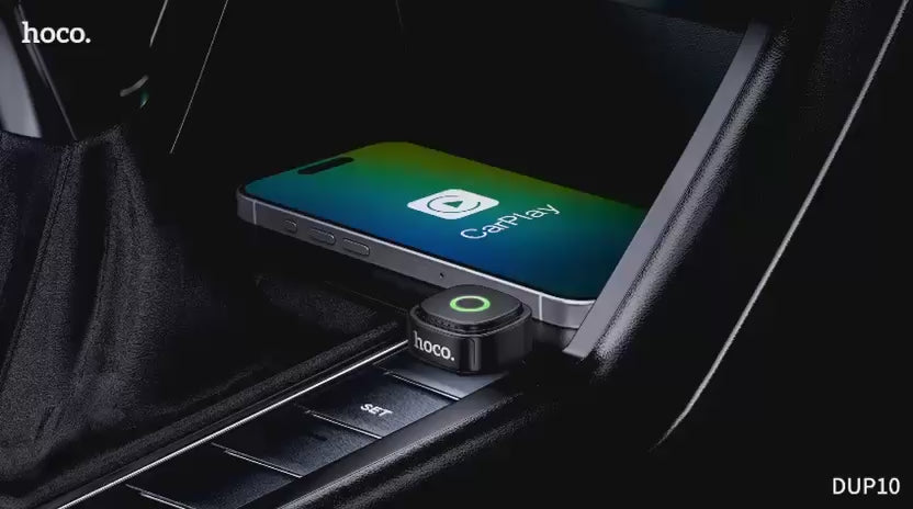 Mini wireless CarPlay dongle HOCO DUP10 plugged into car USB
